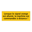 Lorsque le signal orange est allumé, la machine est commandée à distance !