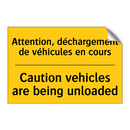 Attention, déchargement de véhicules  /.../ - Caution vehicles are being unloaded /.../