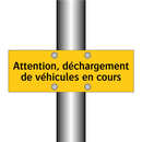 Attention, déchargement de véhicules en cours