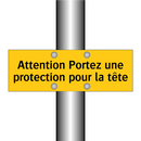 Attention Portez une protection pour la tête