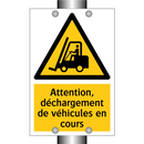 Attention, déchargement de véhicules en cours