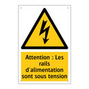 Attention : Les rails d'alimentation sont sous tension