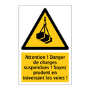 Attention ! Danger de charges suspendues ! Soyez prudent en traversant les voies !