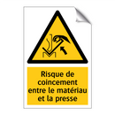 Risque de coincement entre le matériau et la presse