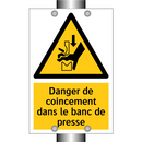Danger de coincement dans le banc de presse