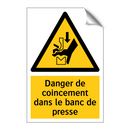 Danger de coincement dans le banc de presse