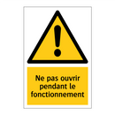Ne pas ouvrir pendant le fonctionnement