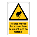 Ne pas mettre les mains dans les machines en marche !
