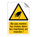Ne pas mettre les mains dans les machines en marche !