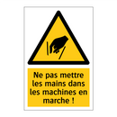 Ne pas mettre les mains dans les machines en marche !
