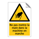 Ne pas mettre la main dans la machine en marche