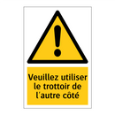 Veuillez utiliser le trottoir de l'autre côté