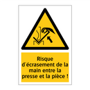 Risque d'écrasement de la main entre la presse et la pièce !