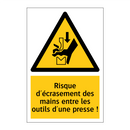 Risque d'écrasement des mains entre les outils d'une presse !