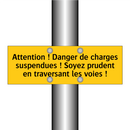 Attention ! Danger de charges suspendues ! Soyez prudent en traversant les voies !