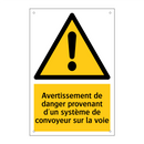 Avertissement de danger provenant d'un système de convoyeur sur la voie