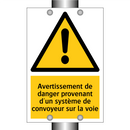Avertissement de danger provenant d'un système de convoyeur sur la voie