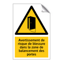 Avertissement de risque de blessure dans la zone de balancement des portes
