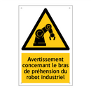 Avertissement concernant le bras de préhension du robot industriel