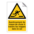 Avertissement du risque de chute à travers les trappes dans le sol