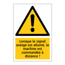 Lorsque le signal orange est allumé, la machine est commandée à distance !