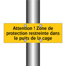 Attention ! Zone de protection restreinte dans le puits de la cage