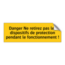 Danger Ne retirez pas les dispositifs de protection pendant le fonctionnement !
