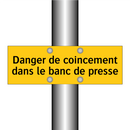Danger de coincement dans le banc de presse